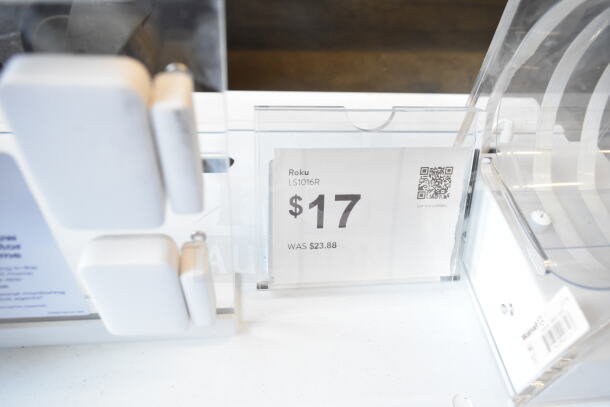 Store display featuring a Roku LS1016R camera priced at $17, previously $23.88, shown with product tags.