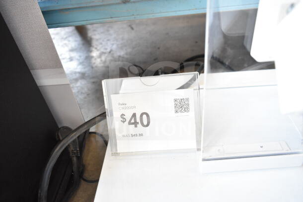 Roku CW2000R display camera priced at $40, originally $49.88. Tag includes a QR code for more details.