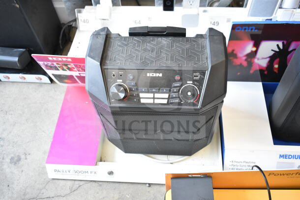 3-store display featuring Ion Party Boom FX speaker, Onn Medium Party Speaker, Samsung speaker; good condition.