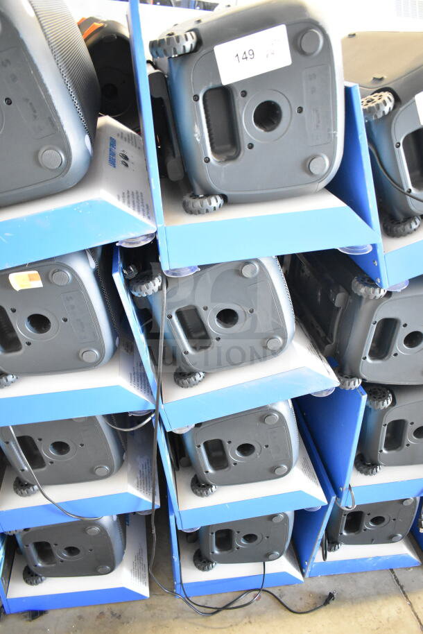 4 store displays featuring Onn large party speakers, each stacked on blue shelving, showcasing speaker bases and wheels.