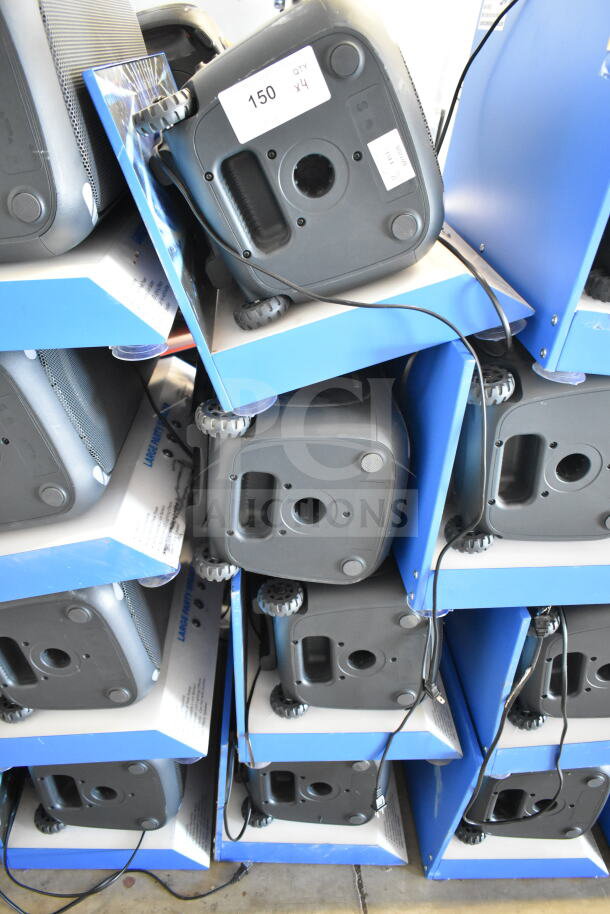 Stack of Onn Large Party Speakers on display. Includes four speakers. Label reads "150 QTY x4." Power cords visible.