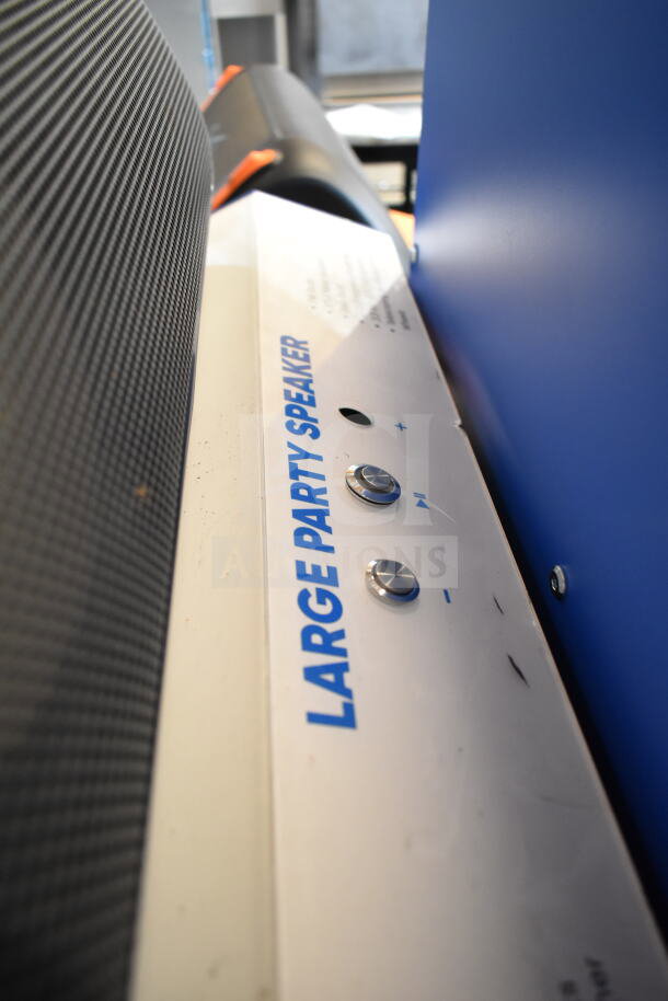 Onn Large Party Speaker display. Features volume controls, labeled "Large Party Speaker." Ideal for events.