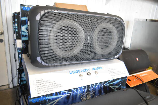 Onn Large Party Speaker on display with Bluetooth, 640W peak power, LED lighting, and rechargeable battery features.