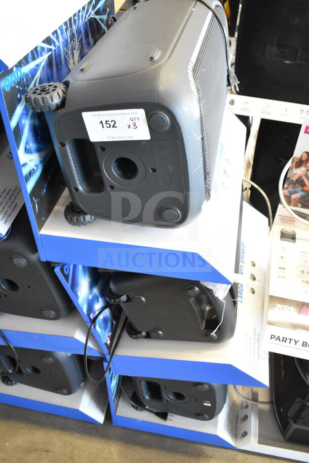 3 store display with Onn large party speakers, model visible. Includes power cords. Tag indicates auction lot 152, QTY 3.
