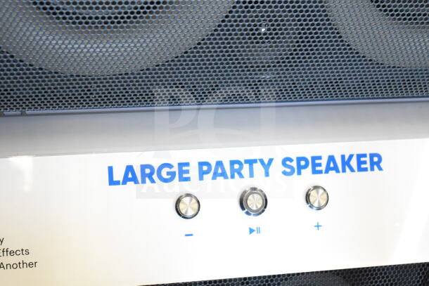 Onn Large Party Speaker, front view with control knobs and grille, labeled "Large Party Speaker" in blue text.