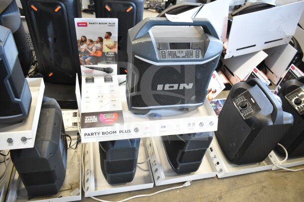 Ion Party Boom Plus speaker display with three units. Features Bluetooth and wide-range sound. Includes promotional material.