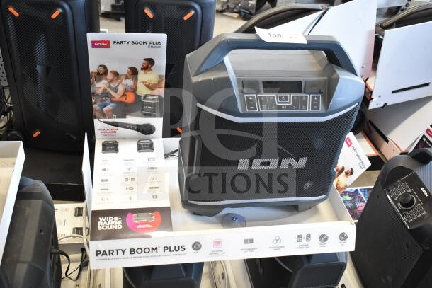 ION Party Boom Plus speaker display with Bluetooth, multi-colored lights, and rechargeable battery. Includes microphone.