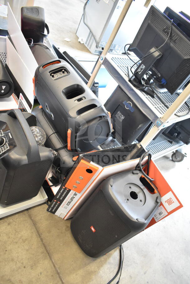 Auction image showing store display with JBL speaker models. Includes visible labels and tags. Consistent condition.