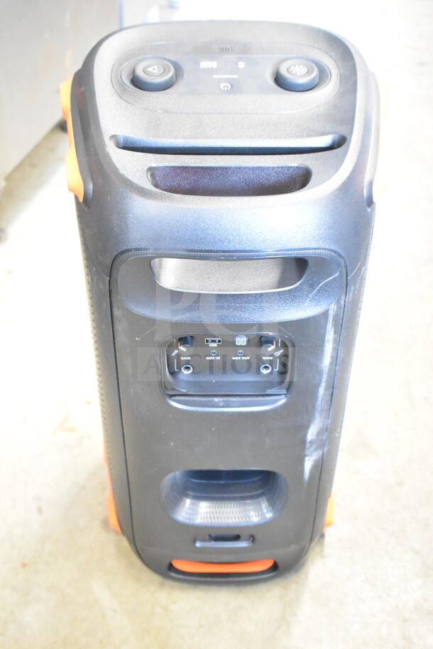 JBL speaker, black with orange accents, features aux input, USB port, and control knobs. Used, good condition.