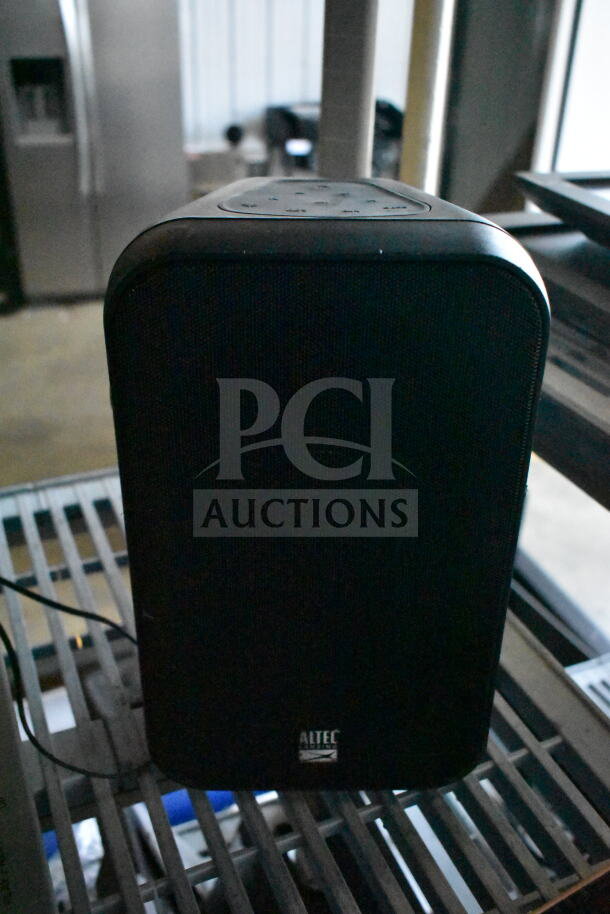 Altec Lansing speaker in good condition, black finish, with control panel on top and visible brand logo on the front.