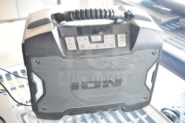 Ion portable speaker with handle, control buttons, Bluetooth connectivity, and durable mesh front. Good condition.