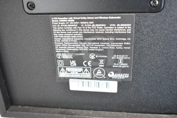 Label on speaker showing model: Cinema SB580, Dolby Atmos, 3.1CH, 25W power, Anatel certified.