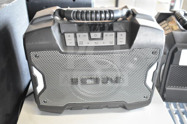 Ion portable speaker with metal grille, handle, and control buttons view. Durable design, suitable for outdoor use.