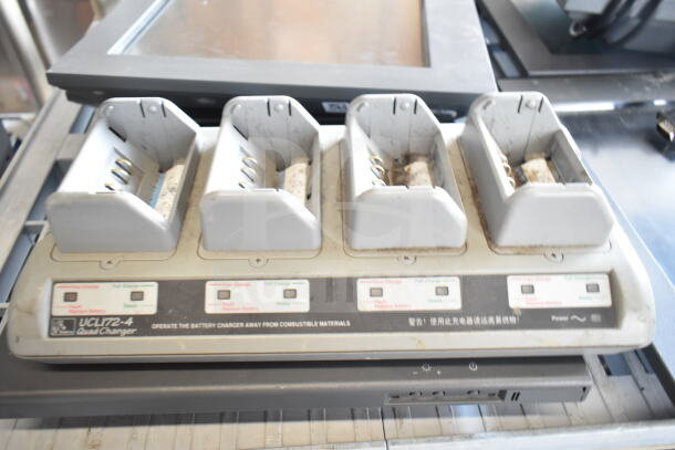 UCL172-4 Quad Charger shown, features 4 charging slots, visible wear. Markings indicate charge status. Part of 6-item set.