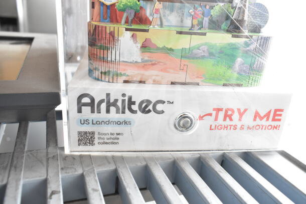 Arkitec Display Unit showcasing US Landmarks, features "Try Me" button for lights and motion, includes QR code for collection.