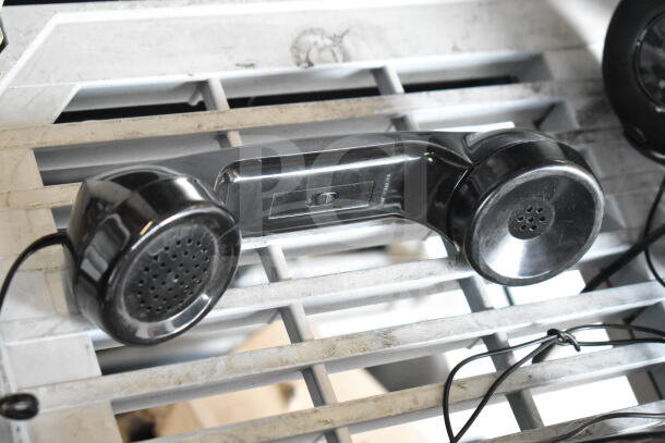 Vintage black telephone handset with coiled wire, shown in used condition, part of auction lot including 3 headphones.