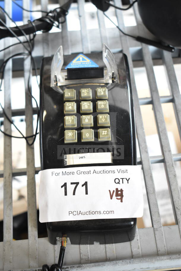 Black Scitec telephone with keypad, auction tag "171" attached, includes 3 headphones, good condition.
