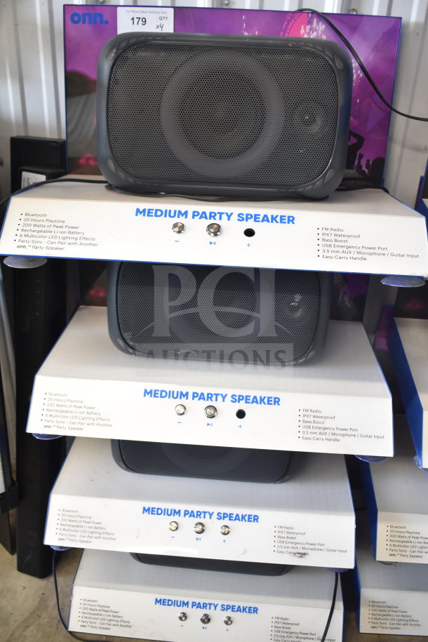 4 store display of Onn Medium Party Speakers with Bluetooth, 20-hour playtime, 200 watts, IPX7 waterproof, and multicolor LED effects.