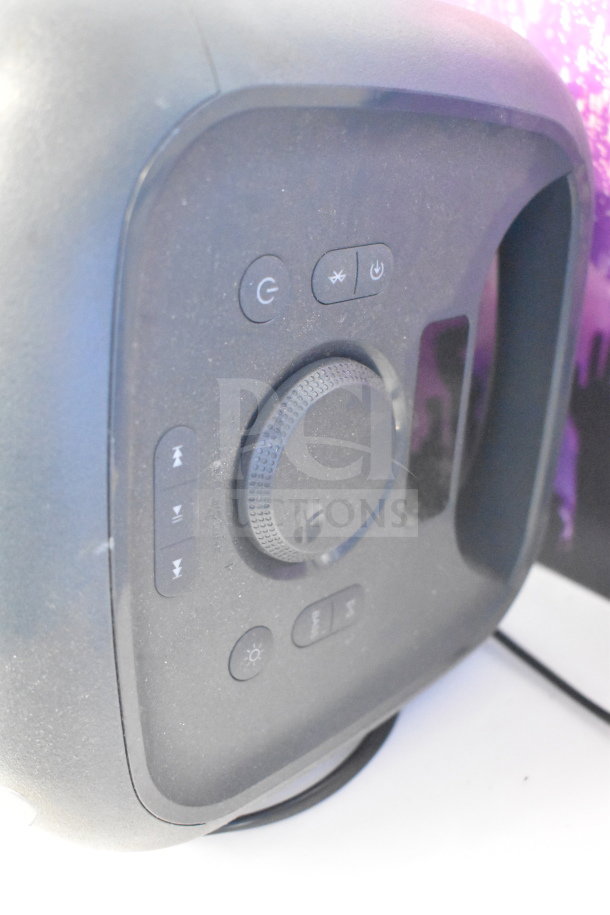 Onn Medium Party Speaker display, black with control panel including power, Bluetooth, and volume buttons, in good condition.