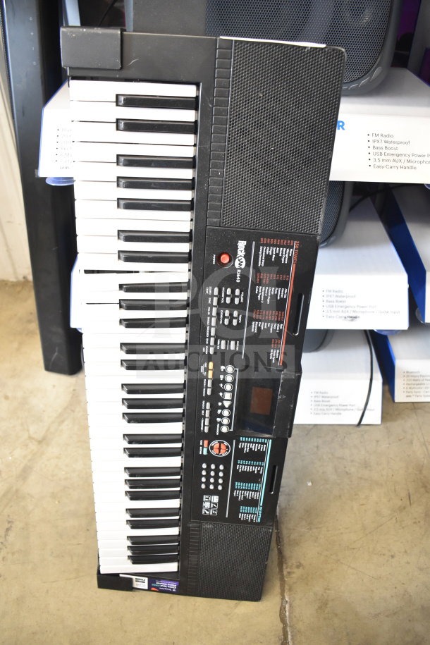 Electronic keyboard with black and white keys, various control buttons, labeled as "Performance" model. In good condition.