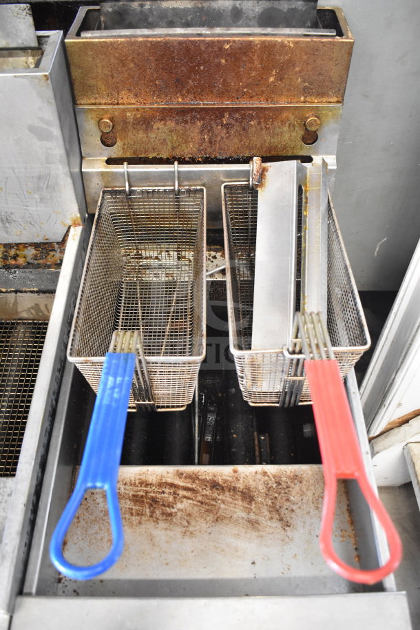 Pitco Frialator SB14RS commercial gas fryer, 122,000 BTU, dual baskets with colored handles, notable wear and rust visible.