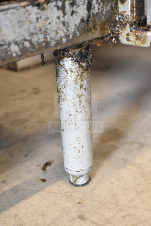 Pitco Frialator SB14RS fryer leg; white, rust-stained, and greasy, indicating heavy use.