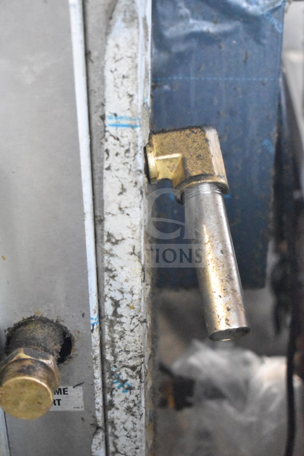 Crown SX-7G3 steam cabinet detail showing natural gas valve. Visible wear, industrial setting, 94,000 BTU model.