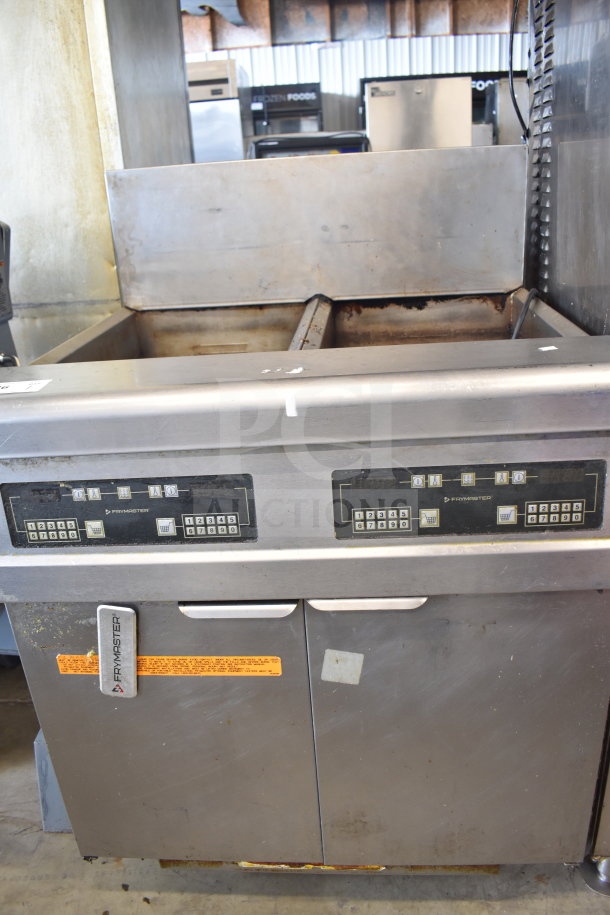 Frymaster FMJ250E 2-bay deep fat fryer with digital controls, natural gas, 122,000 BTU, commercial casters, visible wear.