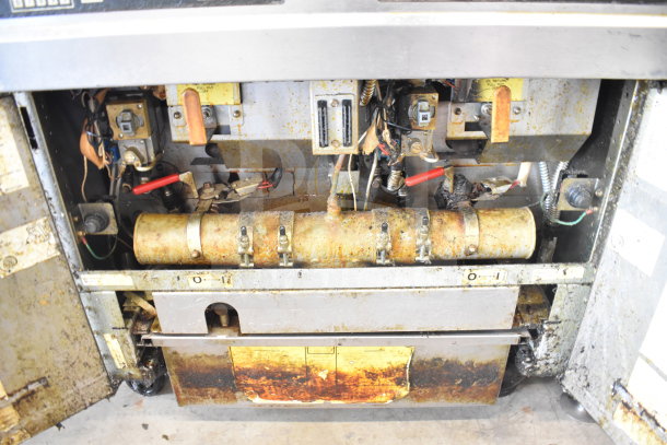 Frymaster FMJ250E 2-bay fryer, natural gas, 122,000 BTU, on casters, showing internal components, in used condition.