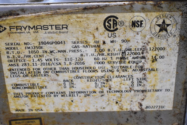 Frymaster FMJ250E commercial fryer label showing specifications: gas-powered, 122,000 BTU, model FMJ250E, ANSI certified.