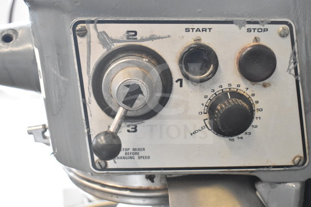 Hobart D300T mixer control panel with speed dial and start/stop buttons. Used condition with visible wear.