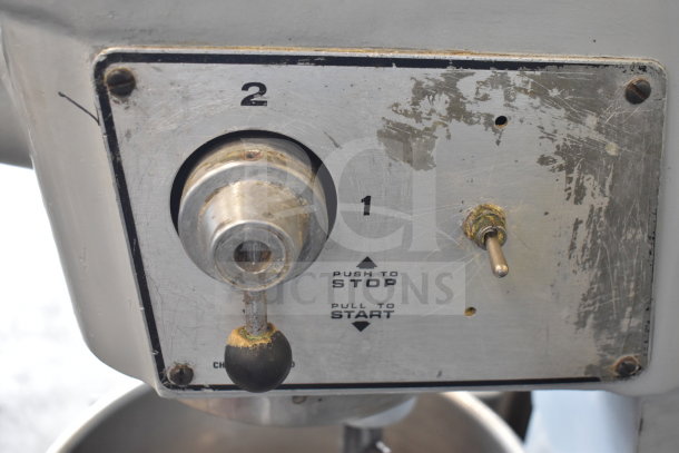 Hobart D300 mixer control panel, showing speed settings. Features a worn metallic surface.