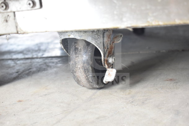 Everest ESR2 cooler caster, commercial use, shows wear with rust. Essential for mobility. 115V, 1 phase power.