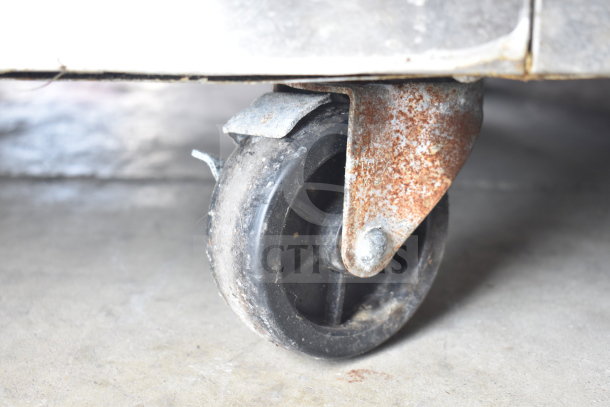 Everest ESR2 cooler, commercial caster detail, showing rust and wear. 115V, 1-phase. Ideal for commercial needs.