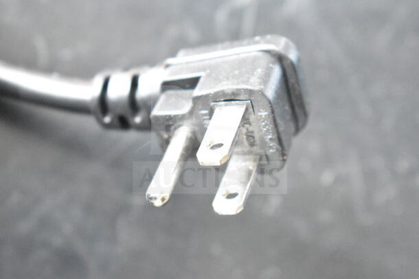 Close-up of a power plug compatible with the Arctic King ARV115B1AST Beverage Cooler, showcasing prongs and cable.