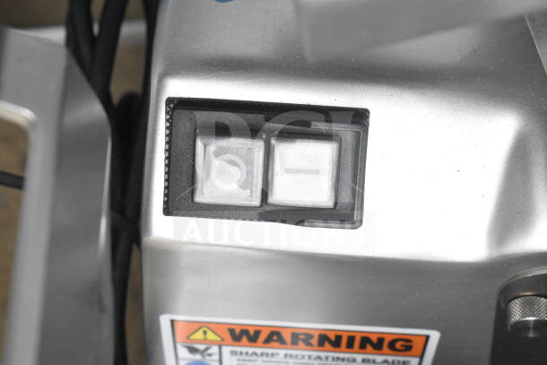 Edlund EDV-12 commercial meat slicer control panel, showing switches and warning label. Carriage needs reattachment. 120V, 1 phase.