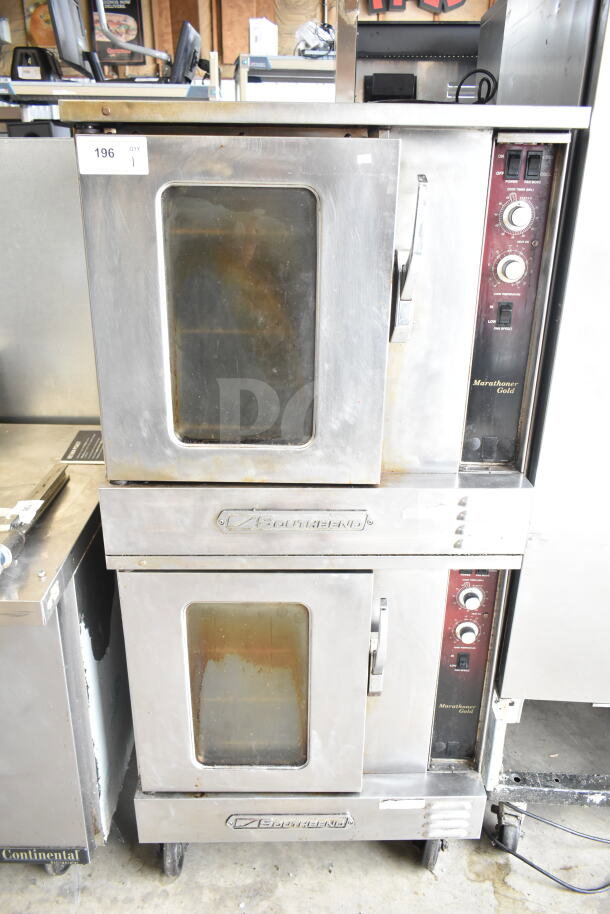Two Southbend Marathoner Gold gas-powered half-size convection ovens with view-through doors, thermostatic controls, on commercial casters.