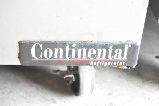 Continental SW48N12M prep table caster label, visible brand mark, commercial use, slight wear.