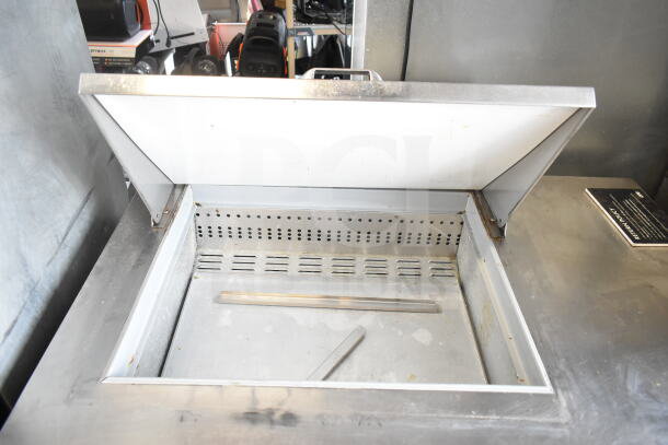 Continental SW48N12M salad prep table with open top, stainless steel finish, on commercial casters. 115V, 1 Phase.