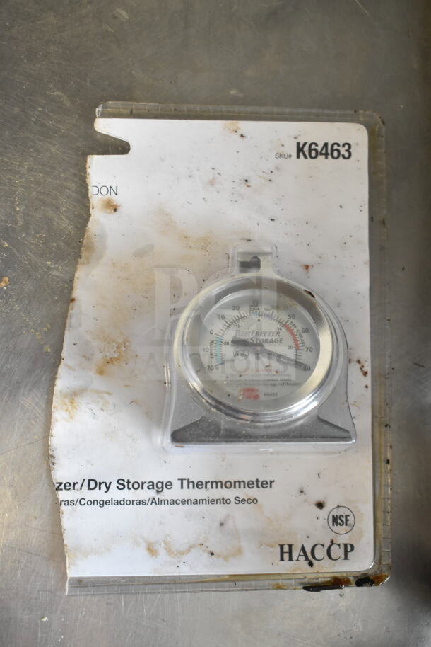 K6463 freezer/dry storage thermometer in packaging, slightly worn, NSF and HACCP logos visible.