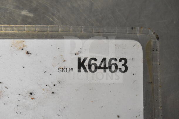 Image shows a label with "SKU# K6463." The label is slightly worn and dirty, indicating use.