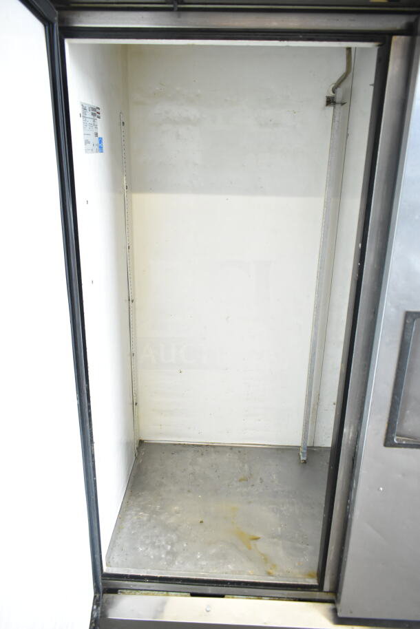 True T-49 commercial 2-door reach-in cooler, 115V, 1 phase, empty interior view, visible interior scuff marks.