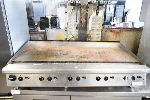 Garland commercial countertop gas flat top griddle, stainless steel, visible wear, manual controls, ideal for professional kitchens.