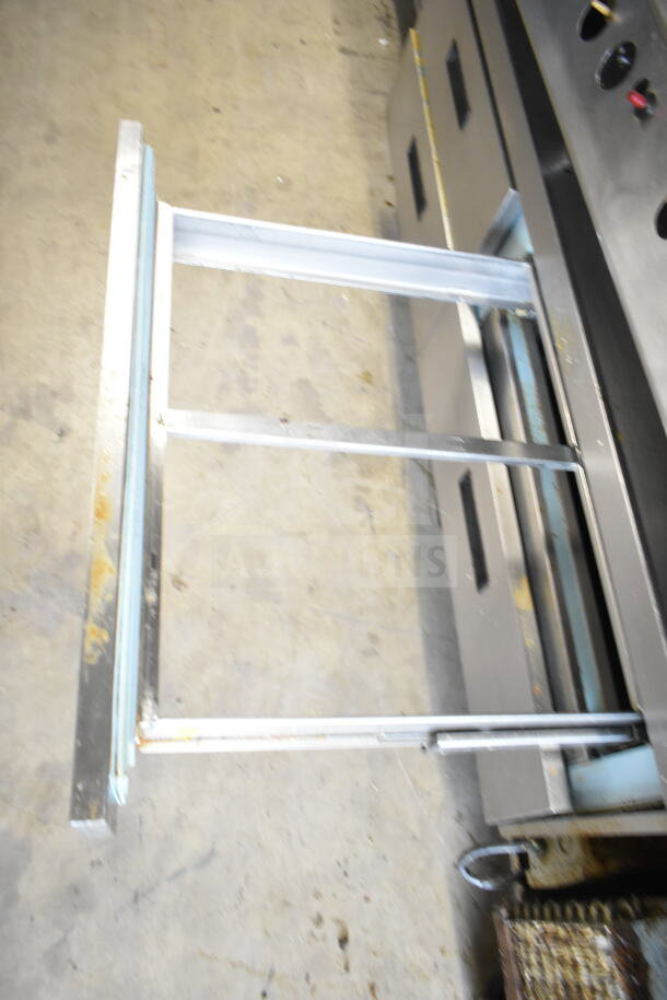 Delfield Commercial 4 Drawer Chef Base with casters, 115V, 1 Phase, visible metal rails, some wear shown.