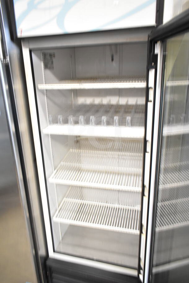 True GDM-23 single door reach-in cooler, commercial use, 115 volts, 1 phase, glass door, wire shelves, clean interior.