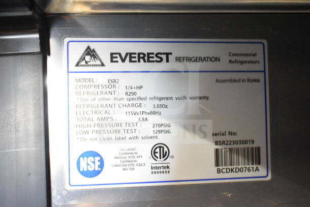 Everest ESR2 Commercial 2 Door Reach In Cooler label, showing model ESR2, 115V, assembled in Korea, NSF certified.