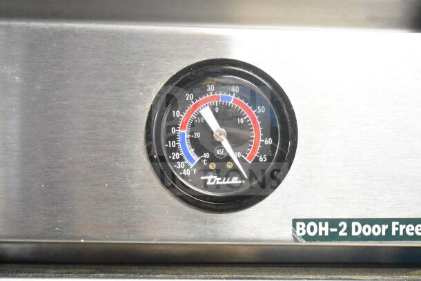 2016 True T-49F Commercial Freezer gauge, NSF certified, sturdy metal with visible "True" branding and temperature readings.