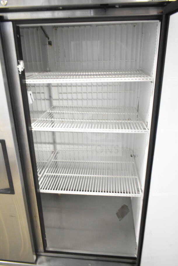 2016 True T-49F Commercial Freezer, 2 doors, reach-in style, 115 volts, 1 phase, open to show shelves, good condition.