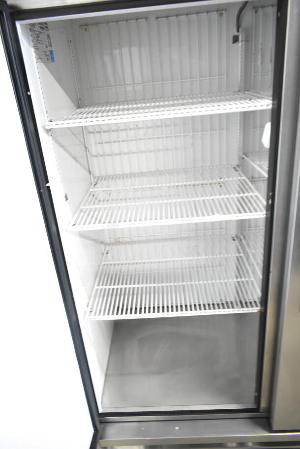 2016 True T-49F commercial 2-door reach-in freezer, 115 volts, 1 phase, stainless steel, with interior shelving.