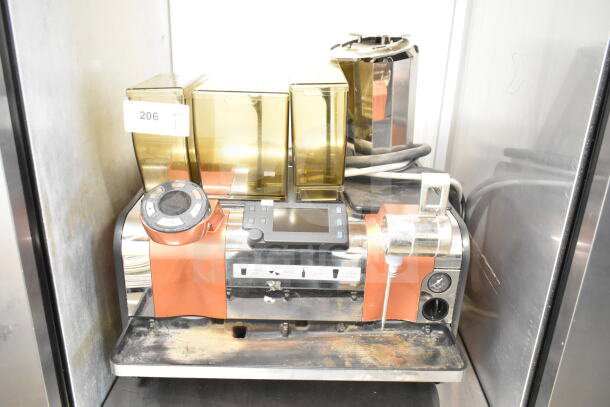 Thermoplan Mastrena stainless steel espresso machine with LCD display, hoppers, and steam wand. 208V, 1 phase. Visible wear.